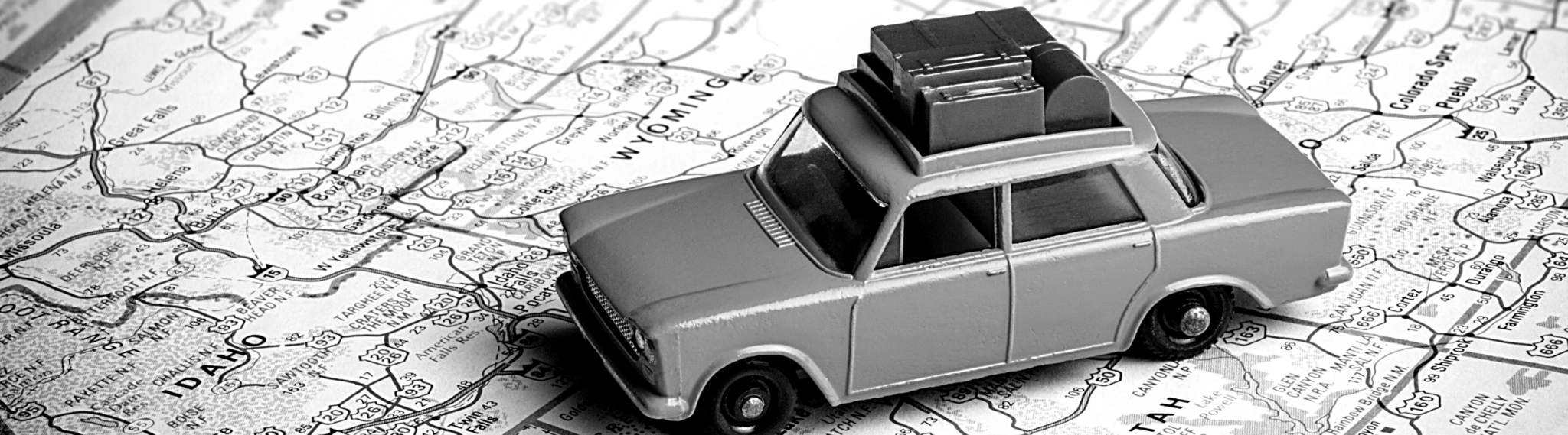 image shows a 1950's style car on a paper map, as a symbol for a software roadmap