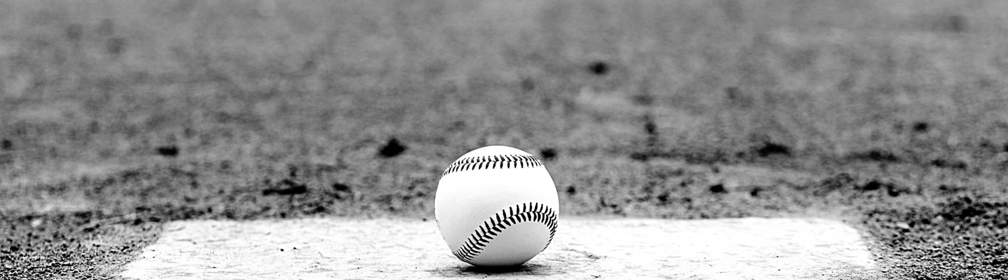 image of a baseball at the plate, waiting for someone to step up