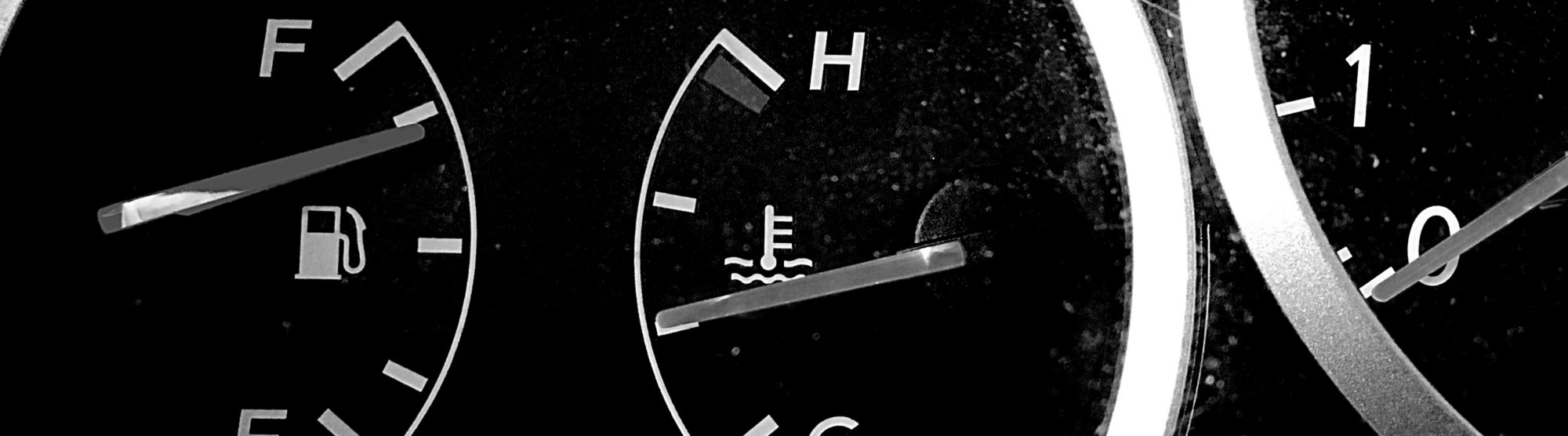 image of a car dashboard, showing the various gauges and fuel icon